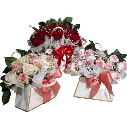 Three flower bouquets with ribbons on a white background
