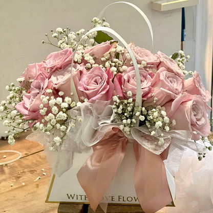 Dozen Pink Roses in a bag shaped arrangement 